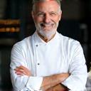 Professional chef in white coat